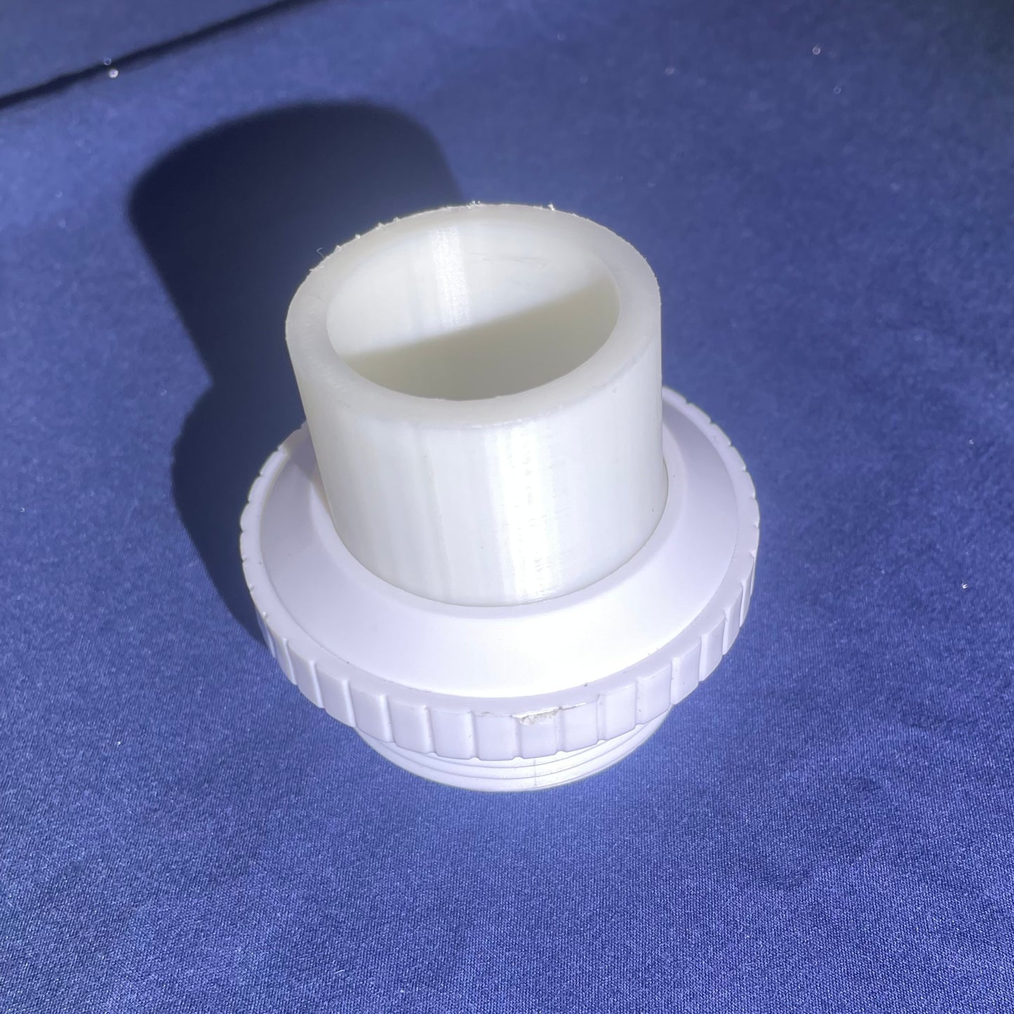 Return water insert and 90 degree bend. Screw on connection.